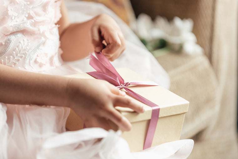 young-girl-opening-gift